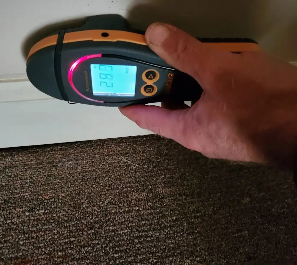 Moisture detection at baseboard during Storm Damage Restoration in Plattsmouth